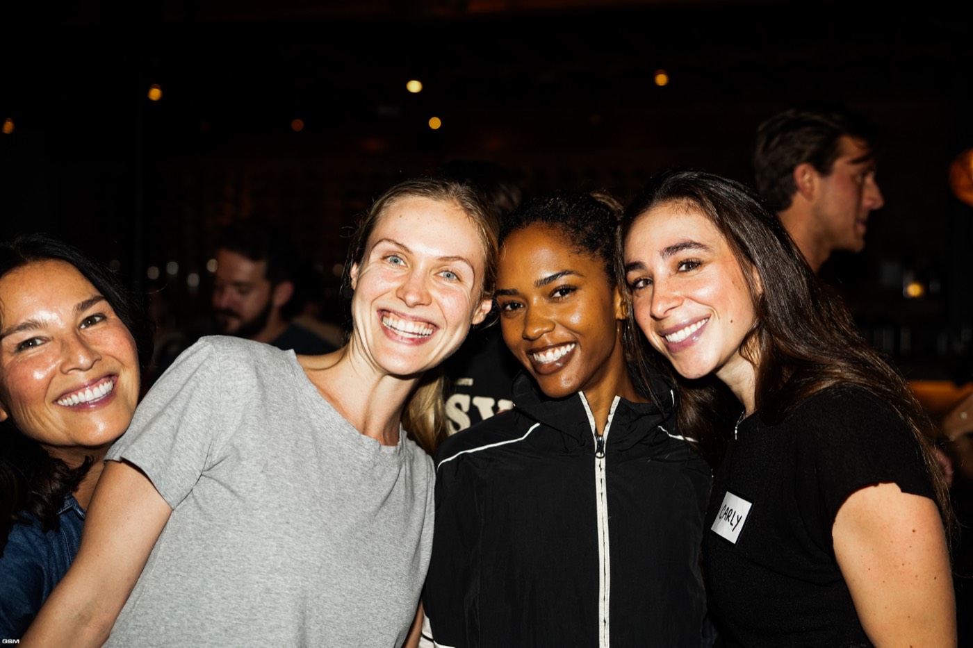 Four friends smiling together at the Joey event in Santa Monica